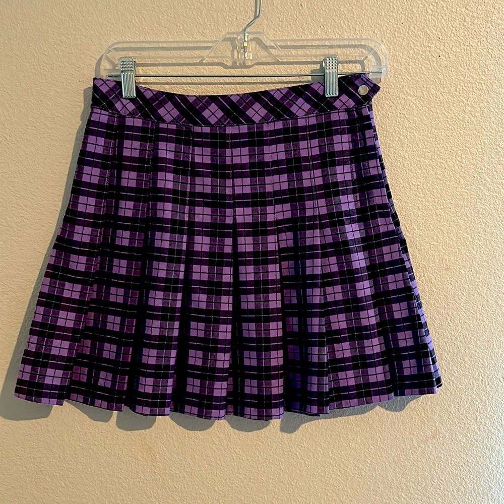 purple skirt with black squares, uses zipper and bottoms.